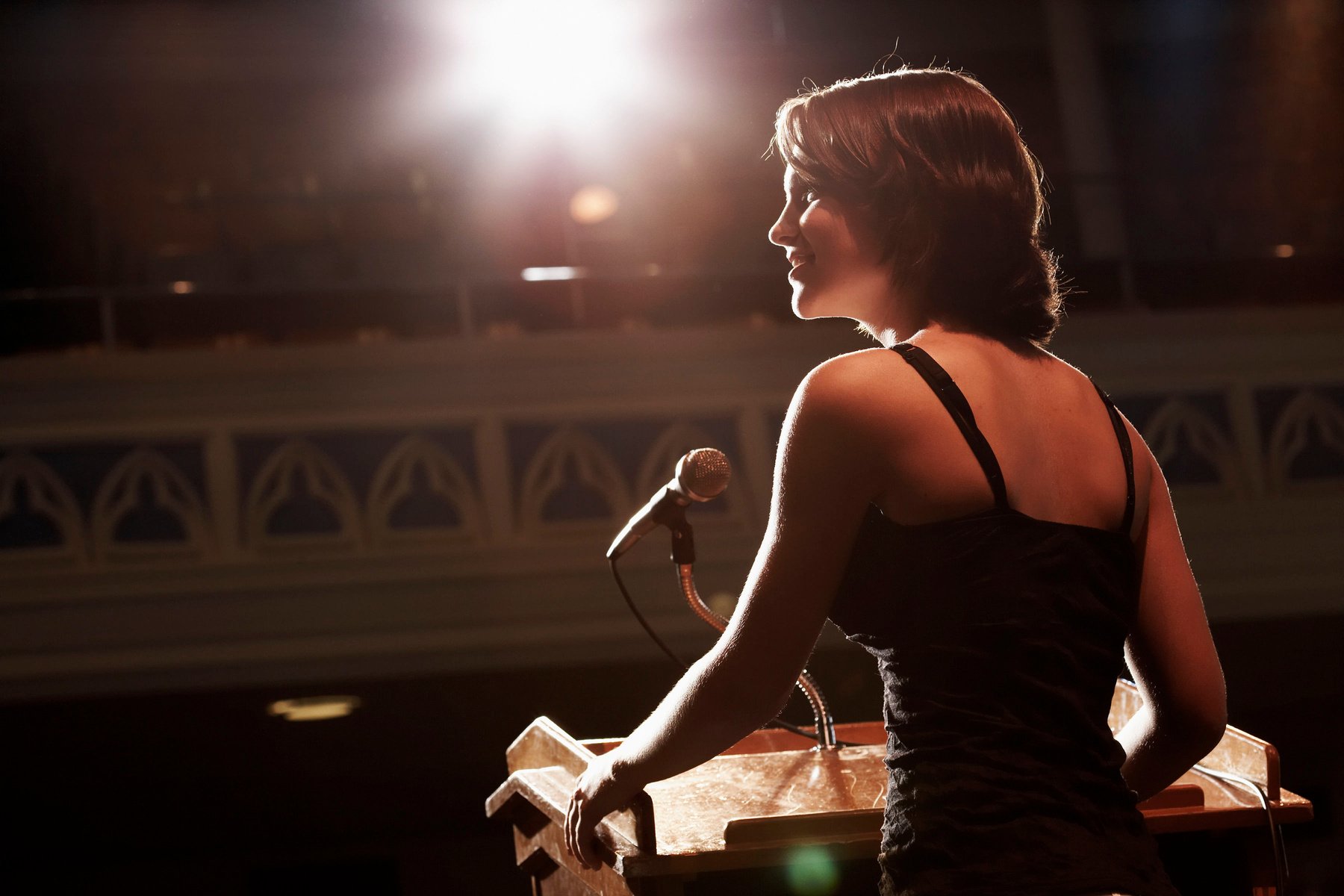 Woman delivering speech at podium